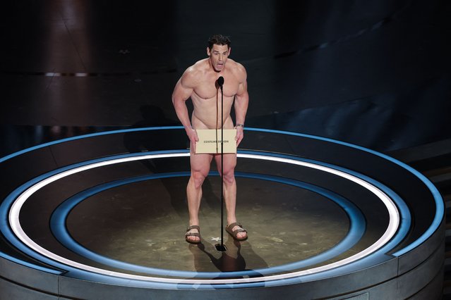 American professional wrestler and actor John Cena performs on stage during the presentation of the Oscar for Costume Design during the Oscars show at the 96th Academy Awards in Hollywood, Los Angeles, California, on March 10, 2024. (Photo by Mike Blake/Reuters)