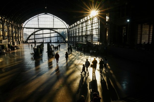 People head to cast their ballots in the former Mapocho railway station during a primary held by the Unidos por Chile coalition to choose the ruling party's candidate for the upcoming presidential election, in Santiago, Chile, Sunday, June 29, 2025. (Photo by Esteban Felix/AP Photo)