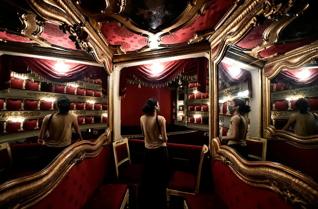 A visitor wearing a face mask looks on as Italy's La Scala opera house reopens to the public for the first time since the coronavirus disease (COVID-19) outbreak, with new social distancing and hygiene rules, in Milan, Italy, June 21, 2020. (Photo by Flavio Lo Scalzo/Reuters)