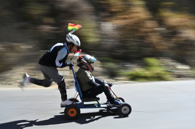 Children drive a homemade car as dozens of participants compete with hand-built motorless vehicles during the XXIV Motorless Car Race, in La Paz, Bolivia, on July 27, 2025. (Photo by Claudia Morales/Reuters)