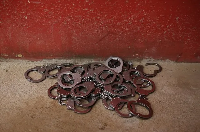 Handcuffs lie on the floor at the entrance of ACUDA's headquarters at a complex of ten prisons in Porto Velho, Rondonia State, Brazil August 28, 2015. (Photo by Nacho Doce/Reuters)