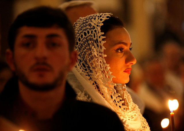 Orthodox believers attend a midnight Christmas service at the Holy Trinity cathedral in Tbilisi, Georgia January 7, 2018. (Photo by David Mdzinarishvili/Reuters)