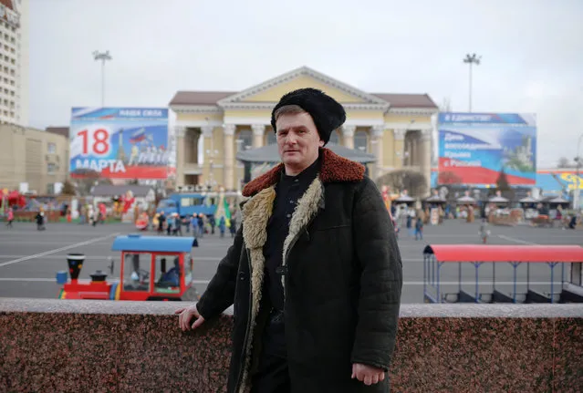Alexander Reshetnyak, 42, Cossack ataman and supporter of presidential candidate Vladimir Putin, poses for a picture in Stavropol, Russia, February 16, 2018. “Of course, among the candidates right now, in my opinion no one can compete with our current president”, said Reshetnyak. “There's no alternative. So yes, maybe these are elections without a genuine choice”. (Photo by Eduard Korniyenko/Reuters)