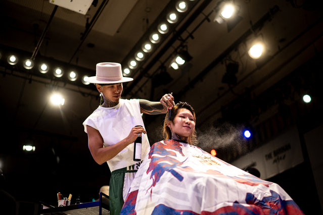 South Korean barber “V” gives a model a haircut during the World Barber Classic at Korakuen Hall in Tokyo on July 14, 2025. (Photo by Philip Fong/AFP Photo)