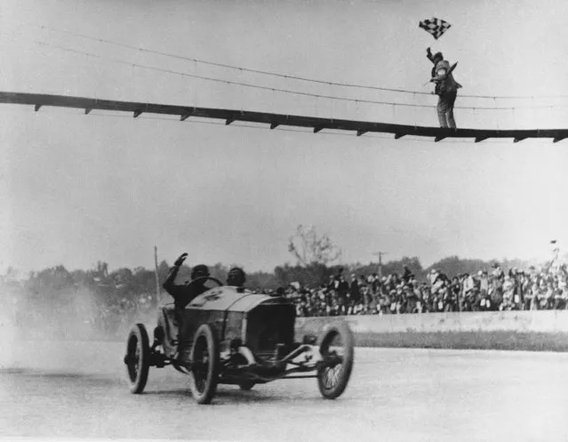 With a crippled engine, Ralph DePalma  of Los Angeles crosses the finish line at Indianapolis Speedway on March 10, 1915. Another engine failure had stopped him near the end of the 1912 race when DePalma led by at least 10 miles. (Photo by AP Photo)