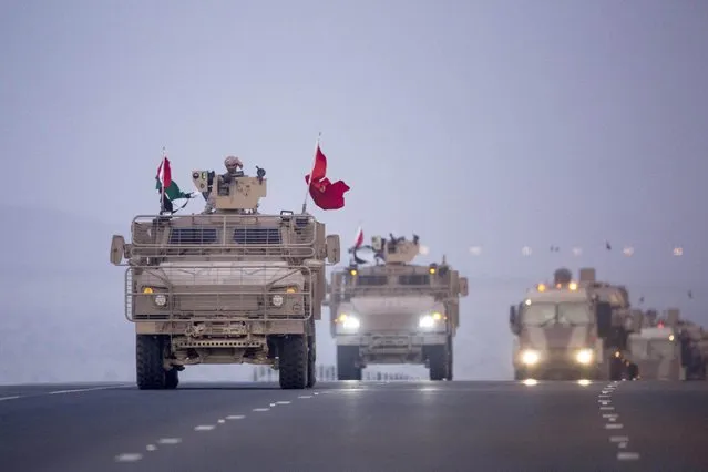 Members of the United Arab Emirates armed forces travel in military vehicles as the first batch of UAE military personnel returns from Yemen in Abu Dhabi, November 7, 2015. (Photo by Reuters/United Arab Emirates News Agency WAM)