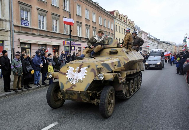 Men dressed as soldiers take part in a parade as part of the Polish Independence Day celebrations in Warsaw, Poland November 11, 2015. (Photo by Jacek Marczewski/Reuters/Agencja Gazeta)