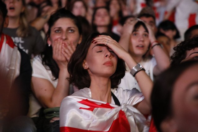 Dejected Georgia supporters watch a public screening of the UEFA EURO 2024 Round of 16 soccer match between Georgia and Spain, in Tbilisi, Georgia, 30 June 2024. (Photo by David Mdzinarishvili/EPA/EFE)