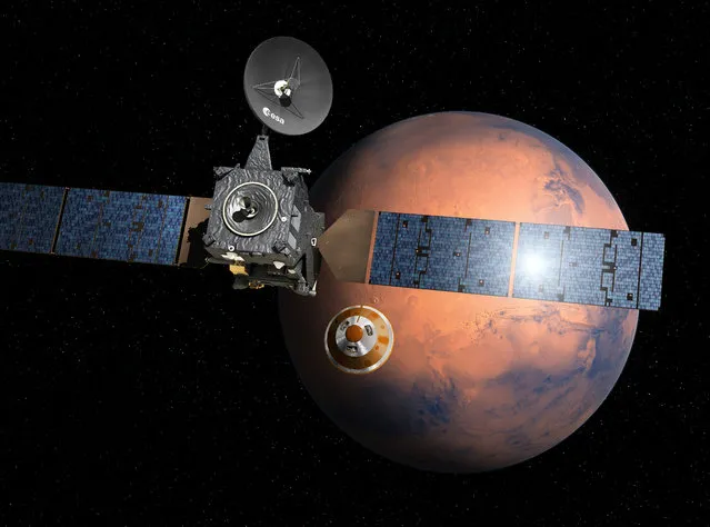 Artist's impression provided by the European Space Agency, ESA, depicting the separation of the ExoMars 2016 entry, descent and landing demonstrator module, named Schiaparelli, center,  from the Trace Gas Orbiter, TGO,lrft,  and heading for Mars.  The separation is scheduled to occur on Sunday October 16, 2016, about seven months after launch. Schiaparelli is set to enter the martian atmosphere on October 19, 2016 while TGO will enter orbit around Mars. The probe will take images of Mars and conduct scientific measurements on the surface, but its main purpose is to test technology for a future European Mars rover. Schiaparelli's mother ship will remain in orbit to analyze gases in the Martian atmosphere to help answer whether there is or was life on Mars. (Photo by ESA/D. Ducros via AP Photo)