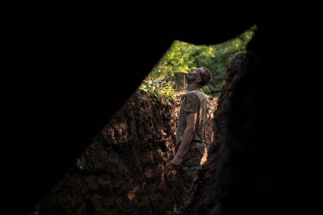 An artilleryman of the 93rd Kholodnyi Yar Separate Mechanized Brigade of the Ukrainian Armed Forces looks out for Russian combat drones at a position on the front line, near the city of Kostiantynivka in Donetsk region, Ukraine, on July 5, 2025. (Photo by Viacheslav Ratynskyi/Reuters)