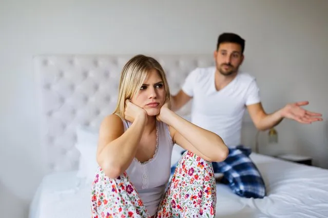 Young unhappy couple having problems in relationship. (Photo by Andor Bujdoso/Alamy Stock Photo)