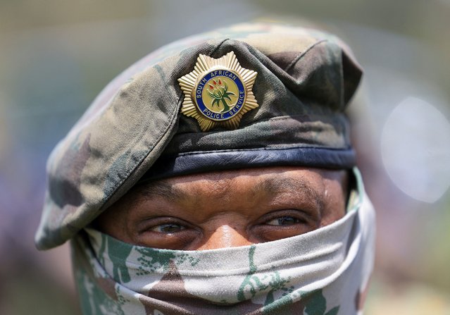 A member of the South African Police force looks on during the integrated law enforcement parade, which forms part of the readiness operations for the upcoming G20 Summit, in Johannesburg, South Africa, on November 19, 2025. (Photo by Esa Alexander/Reuters)