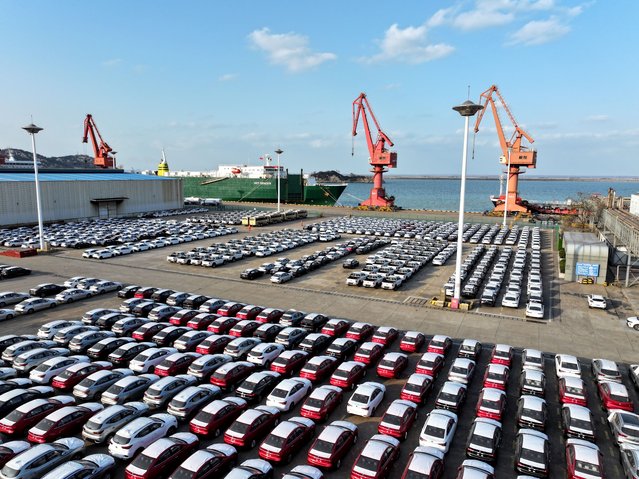 In an aerial view, export-bound vehicles wait to be loaded onto ro-ro ships for export at Lianyungang Port on December 1, 2025 in Lianyungang, Jiangsu Province of China. (Photo by Wang Chun/VCG via Getty Images)