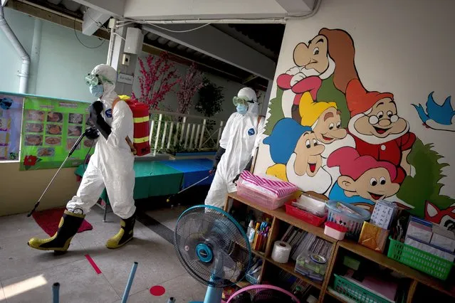 Firefighters disinfect a kindergarten ahead of schools re-opening, in Bangkok, Thailand, 28 January 2021. The Thai government announced the re-opening of schools as of 01 February 2021, after they were ordered closed as part of preventive measures to help curb the spread of COVID-19. (Photo by Diego Azubel/EPA/EFE)
