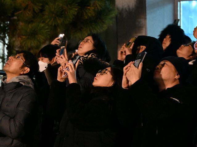 Citizens watch the fourth launch of the Korean Space Launch Vehicle Nuriho from across the Oenaro Launch Complex in Goheung, South Jeolla Province, on the morning of the November 27, 2025. (Photo by Jang Gyeong-sik)