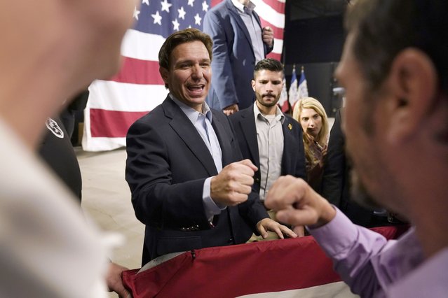 Republican presidential candidate Florida Gov. Ron DeSantis greets audience members during a campaign event, Tuesday, May 30, 2023, in Clive, Iowa. (Photo by Charlie Neibergall/AP Photo)