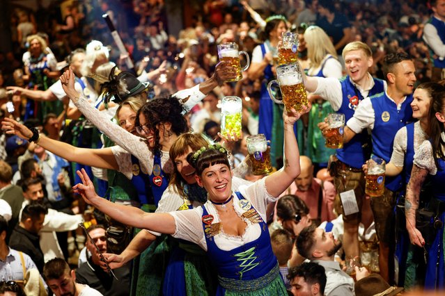 Oktoberfest waitresses toast with beer while they celebrate the end of the world’s biggest beer festival, the 189th Oktoberfest, in Munich, Germany, on October 6, 2024. (Photo by Michaela Stache/Reuters)