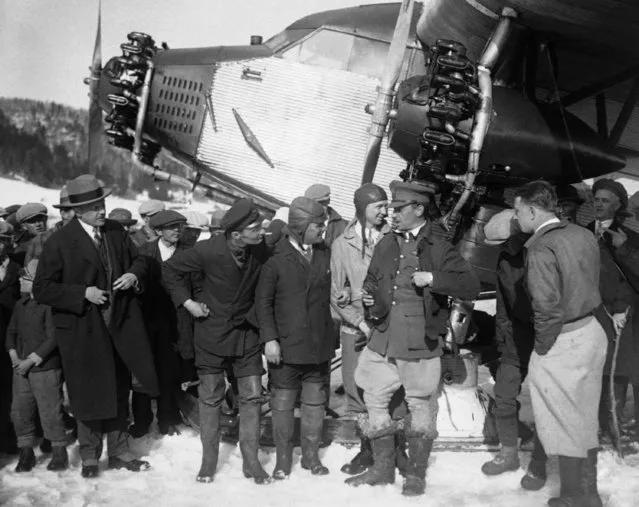 The first plane to make westward trans-Atlantic flight, is welcomed at Lake Ste. Agnes, Que in Canada on April 27, 1928 after non-stop flight in the Ford Relief plane.  Crew of Bremen. (Photo by AP Photo)