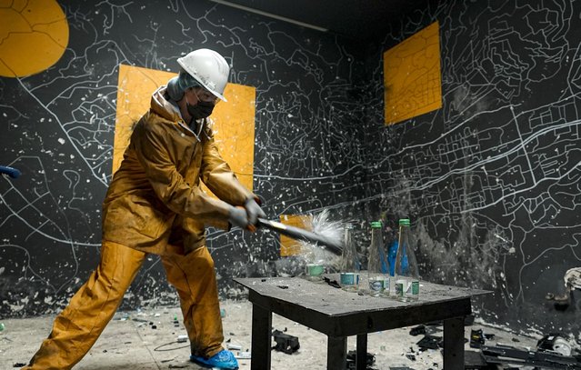 People, wearing special equipment, vent their anger by smashing or hitting things around them with a sledgehammer or baseball bat at “rage room” as they have opportunity to get away from the stress of daily life by breaking things in Sarajevo, Bosnia and Herzegovina on January 25, 2025. (Photo by Samir Jordamovic/Anadolu via Getty Images)