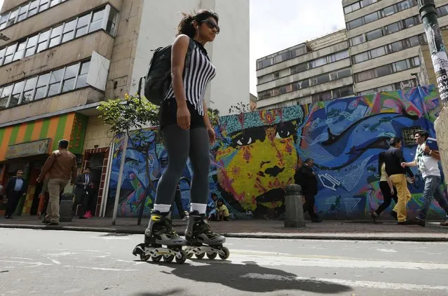 A woman rollerblades during “No Car Day” in Bogota February 5, 2015. The event was organized by the mayoral office of Bogota to encourage residents to use other modes of public transportation to help reduce the amount of pollution. (Photo by John Vizcaino/Reuters)