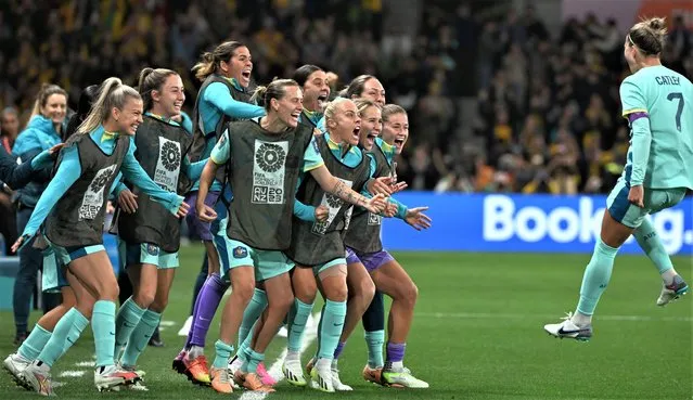 Australia's defender #07 Stephanie Catley (R) celebrates with teammates after scoring her team's fourth goal from the penalty kick during the Australia and New Zealand 2023 Women's World Cup Group B football match between Canada and Australia at Melbourne Rectangular Stadium, also known as AAMI Park, in Melbourne on July 31, 2023. (Photo by William West/AFP Photo)