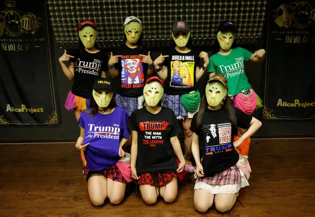 Members of Japanese idol group Kamen Joshi (Masked Girls) in attires featuring images or names of U.S. President-elect Donald Trump, pose for a photo after their concert at their theatre in Tokyo's Akihabara district, Japan, December 12, 2016. (Photo by Toru Hanai/Reuters)