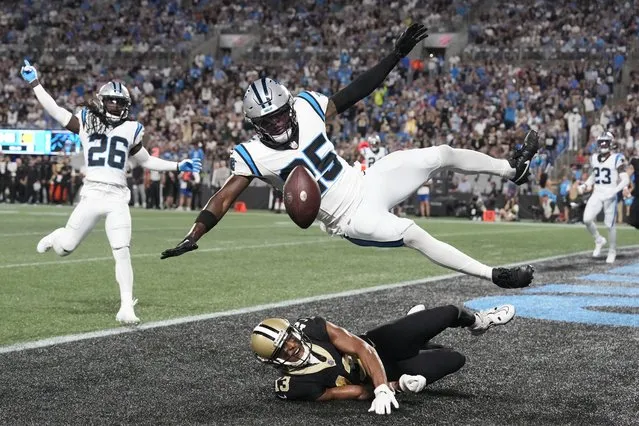 Carolina Panthers safety Xavier Woods (25) breaks up a pass in the end zone intended for New Orleans Saints wide receiver Michael Thomas (13) as Carolina Panthers cornerback Donte Jackson (26) is in the background in the second quarter at Bank of America Stadium in Charlotte, North Carolina on September 18, 2023. (Photo by Bob Donnan/USA TODAY Sports)