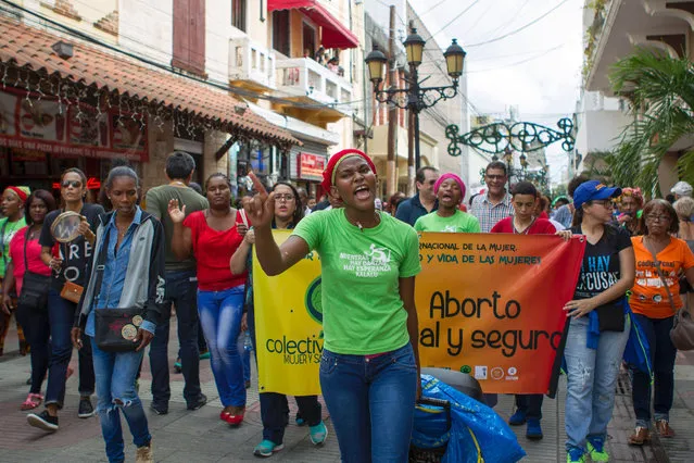 People take part in a march demanding Dominican President Danilo Medina to review the penal code and not approve the criminalization of abortion, in Santo Domingo on December 18, 2016. Dominican Republic has one of the highest rates of maternal mortality, largely associated with clandestine abortions performed in unsafe conditions -third cause of maternal death- and which mainly affects women living in poverty. (Photo by Erika Santelices/AFP Photo)