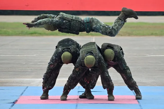 A Taiwanese special forces unit demonstrate their combat skills during a military open house event in Hsinchu on September 21, 2023. (Photo by Sam Yeh/AFP Photo)