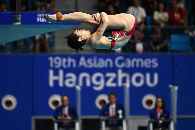 China’s Chang Yani competes in the finals of the women's 3m springboard diving event during the Hangzhou 2022 Asian Games in Hangzhou in China's eastern Zhejiang province on October 4, 2023. (Photo by Manan Vatsyayana/AFP Photo)