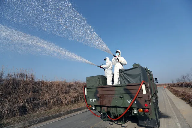 South Korean navy soldiers disinfect in Changwon, South Korea, January 3, 2017. (Photo by Kim Dong-min/Reuters/Yonhap)