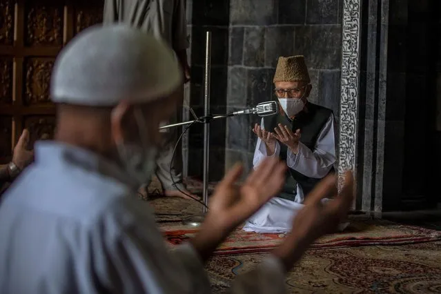 Kashmiri men take part in Friday prayers inside Jamia Masjid, or Grand Mosque, that remained closed for nearly five months due to the COVID-19 pandemic in Srinagar, Indian Controlled Kashmir, Friday, August 6, 2021. (Photo by Dar Yasin/AP Photo)