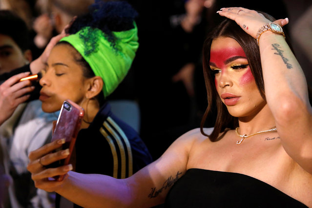 Transgender model Jessica Cortez checks herself in her phone before walking at the CHULO underwear show during the New York Fashion Week, which raised money for transgender and cisgender young women victims of violence, in New York, February 7, 2019. (Photo by Andrew Kelly/Reuters)