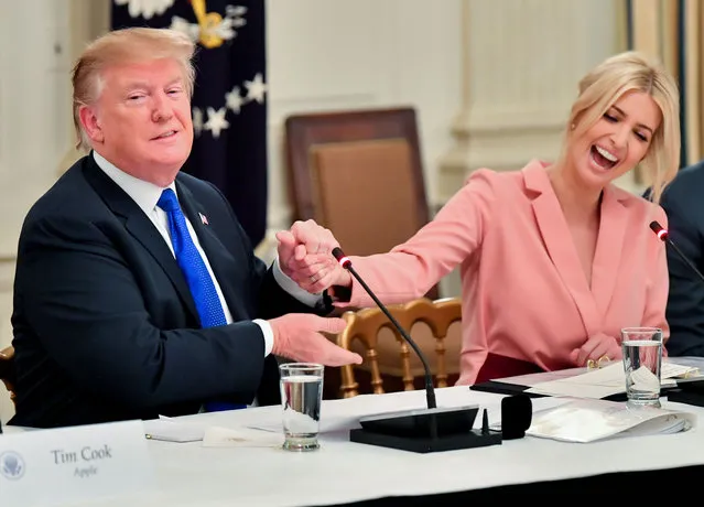 U.S. President Donald Trump greets Ivanka Trump, assistant to U.S. President Donald Trump, during an American Workforce Policy Advisory board meeting in the State Dining Room of the White House in Washington, D.C., U.S., on Wednesday, March 6, 2019. Senator Chuck Grassley of Iowa, one of the few Republicans with the power to request President Trump's tax returns wants to make sure that if House Democrats are successful in getting them, he wants to see them, too. (Photo by UPI/Barcroft Images)