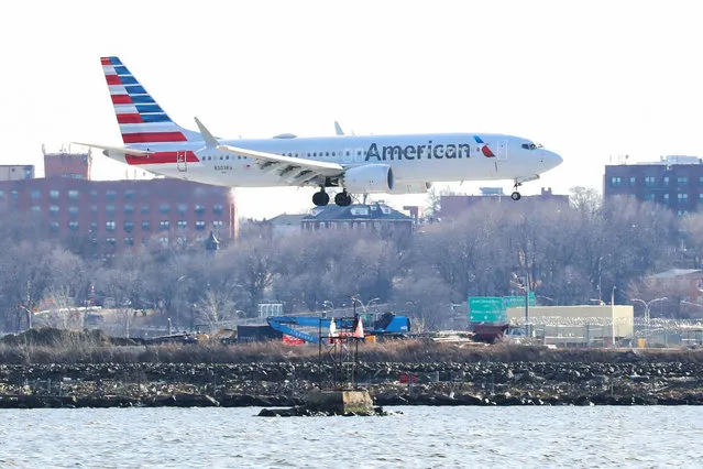 An American Airlines Boeing 737 Max 8, on a flight from Miami to New York City, comes in for landing at LaGuardia Airport in New York, U.S., March 12, 2019. President Donald Trump says the U.S. is issuing an emergency order grounding all Boeing 737 Max 8 and Max 9 aircraft in the wake of a crash of an Ethiopian Airliner. (Photo by Shannon Stapleton/Reuters)