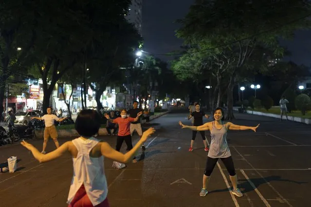 People exercise at a park in Ho Chi Minh City, Vietnam, January 11, 2024. (Photo by Jae C. Hong/AP Photo)