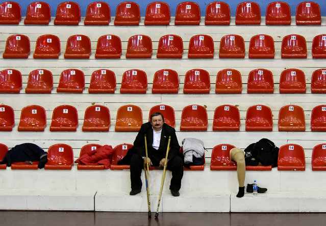 A spectator watches a regional championship among wheelchair basketball teams in the far eastern city of Vladivostok, Russia March 18, 2019. (Photo by Yuri Maltsev/Reuters)