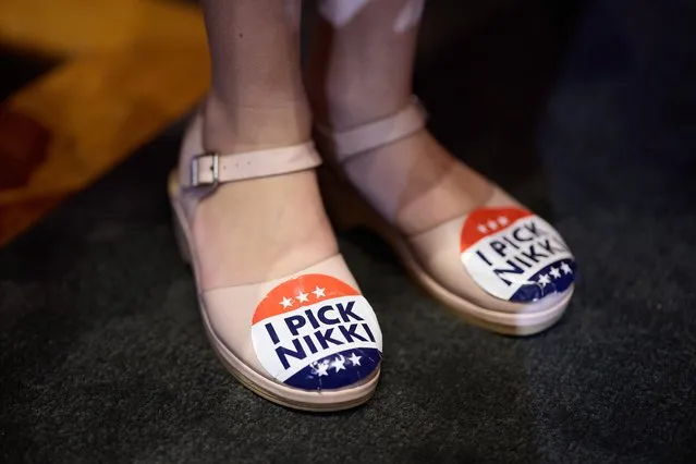 A supporter of US Republican presidential hopeful and former UN Ambassador Nikki Haley wears stickers on her shoes at an election rally at the Hollywood American Legion in Los Angeles, California USA, 07 February 2024. Former South Carolina Governor Nikki Haley is running against former US President Donald Trump in the Republican Presidential Primary. (Photo by Allison Dinner/EPA/EFE)