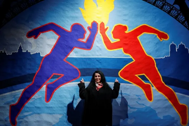 French-Iranian artist Marjane Satrapi poses in front of the Olympic tapestry in Paris, France, on March 12, 2024. (Photo by Benoit Tessier/Reuters)