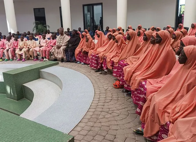 Nigerian students and staff who were kidnapped this month sit at the local government house after they were freed, in Kaduna, Nigeria on March 25, 2024. (Photo by Garba Muhammad/Reuters)