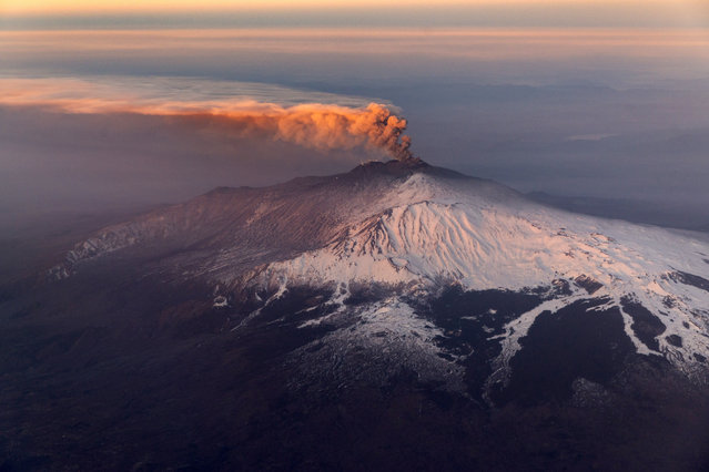 Smoke billows from Mount Etna volcano, the largest of Italy's three active volcanoes, near the Sicilian town of Catania, southern Italy, Wednesday, February 20, 2019. (Photo by Salvatore Allegra/AP Photo)
