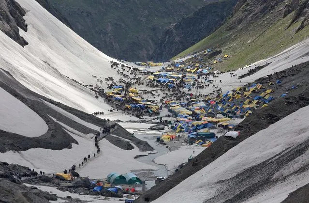 Hindu pilgrims arrive to worship at the holy cave of Lord Shiva in Amarnath, southeast of Srinagar, July 2, 2019. Picture taken July 2, 2019. (Photo by Mukesh Gupta/Reuters)
