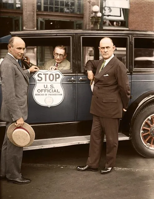 Stop when you see this sign. This is the new insignia plate the Bureau of Prohibition has adopted for use by prohibition agents in stopping suspected automobiles. In the photograph, from left to right, are; Prohibition Administrator Ames Woodcock, H.M. Lucious, secretary of the Automobile Club of Maryland, and Ernest M.Smith, vice- president of the A.A.A., 30th August 1925. (Photo by Tom Marshall/Mediadrumworld)