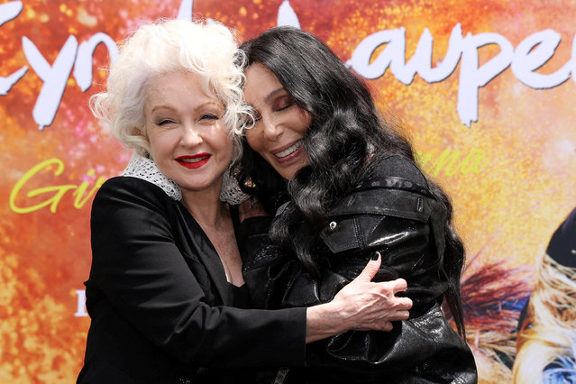 Singer Cyndi Lauper poses with Cher during her handprints ceremony at TCL Chinese Theatre in Los Angeles, California, U.S., June 4, 2024. (Photo by Mario Anzuoni/Reuters)