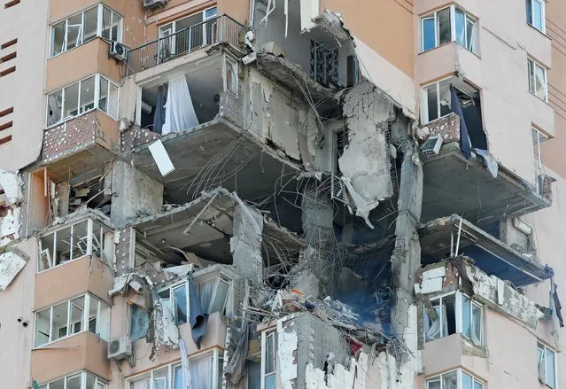 A view shows an apartment building damaged by recent shelling in Kyiv, Ukraine on February 26, 2022. (Photo by Gleb Garanich/Reuters)
