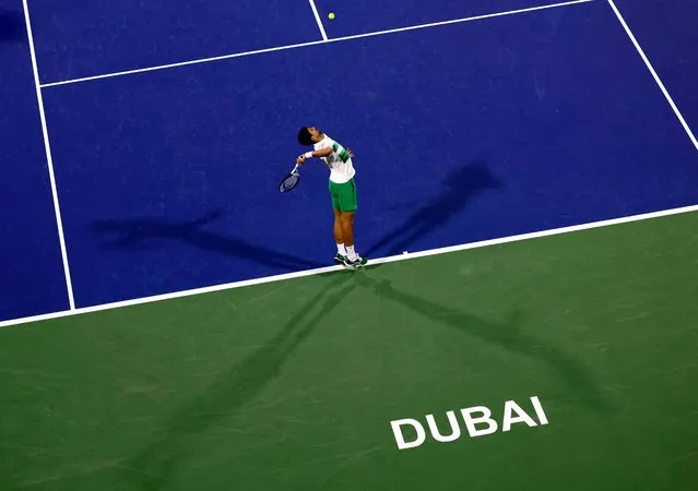 Serbia's Novak Djokovic serves the ball to Czech Republic's Jiri Vesely during their quarter-final match at the ATP Dubai Duty Free Tennis Championship, in the Gulf emirate on February 24, 2022. (Photo by Karim Sahib/AFP Photo)