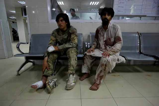 Wounded men wait for treatment after a blast, at a hospital in Jalalabad, Afghanistan, May 10, 2016. (Photo by Reuters/Parwiz)
