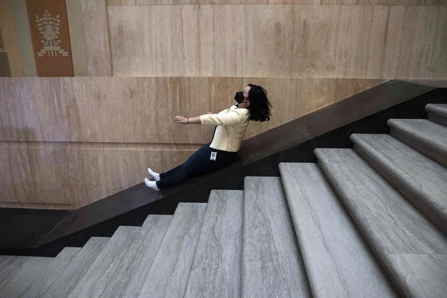 Rep. Wlnsvey Campos, D-Aloha, slides down the stairs after sine die, the final adjournment of the assembly without a day being set for reconvening, at the Oregon State Capitol Building in Salem, Ore. on Friday, March 4, 2022. (Photo by Brian Hayes/Statesman-Journal via AP Photo)