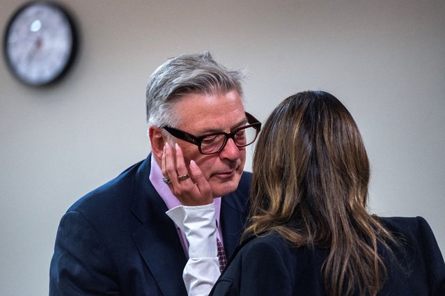 Actor and producer Alec Baldwin talks with his wife Hilaria Baldwin in First District Court during the first day of testimony in the case against him, in Santa Fe, N.M. Wednesday, July 10, 2024. Baldwin is on trial for the charge of involuntary manslaughter related to the death of cinematographer Halyna Hutchins during the filming of the movie Rust in 2021. (Photo by Eddie Moore/Journal/Pool via Reuters)