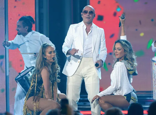 (L-R) Singer/actress Jennifer Lopez, recording artist Pitbull and singer Claudia Leitte perform onstage during the 2014 Billboard Music Awards at the MGM Grand Garden Arena on May 18, 2014 in Las Vegas, Nevada. (Photo by Ethan Miller/Getty Images)